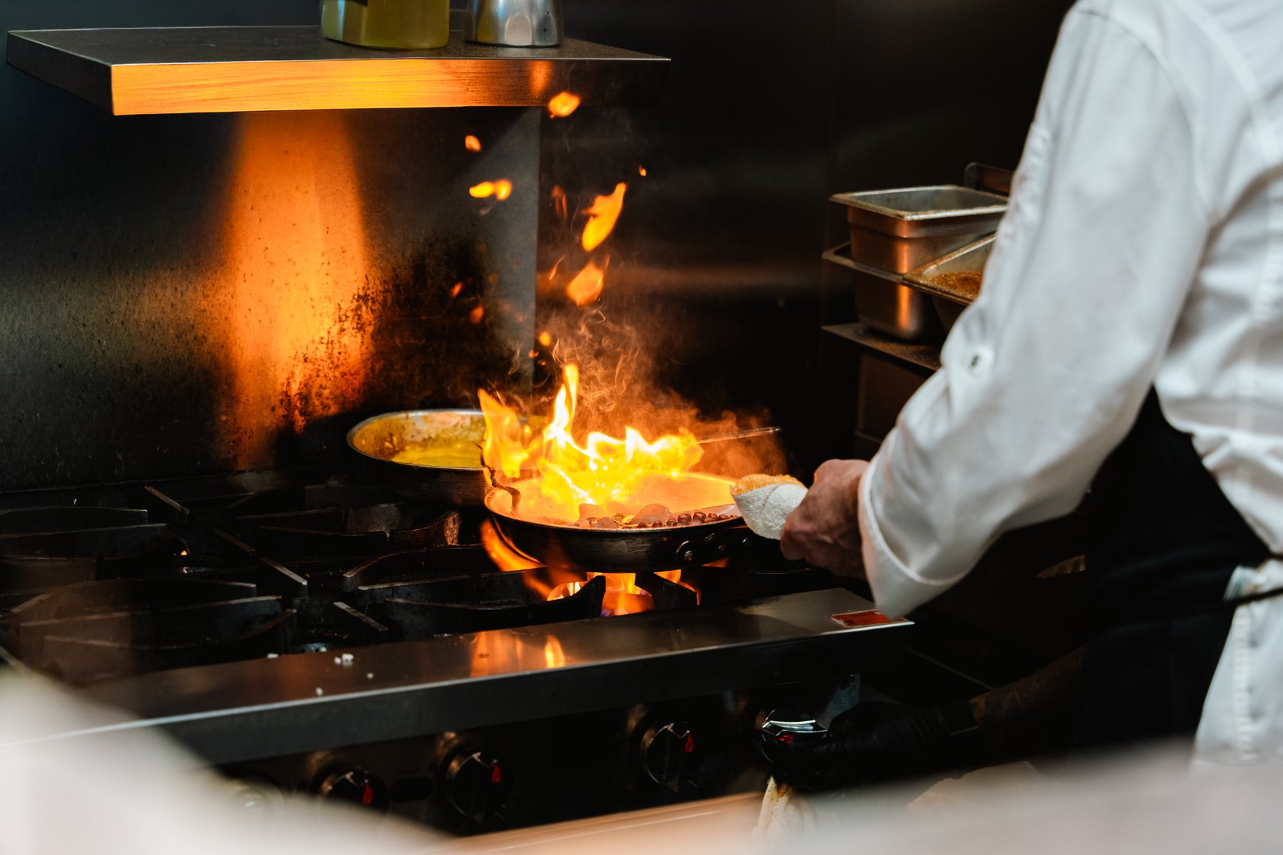 Open-flame kitchen photographed by Zu Group